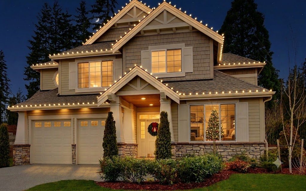 Craftsman home outlined in warm white C9 bulbs at night